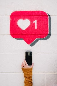 A red, heart-shaped social media notification -Trending buzzwords